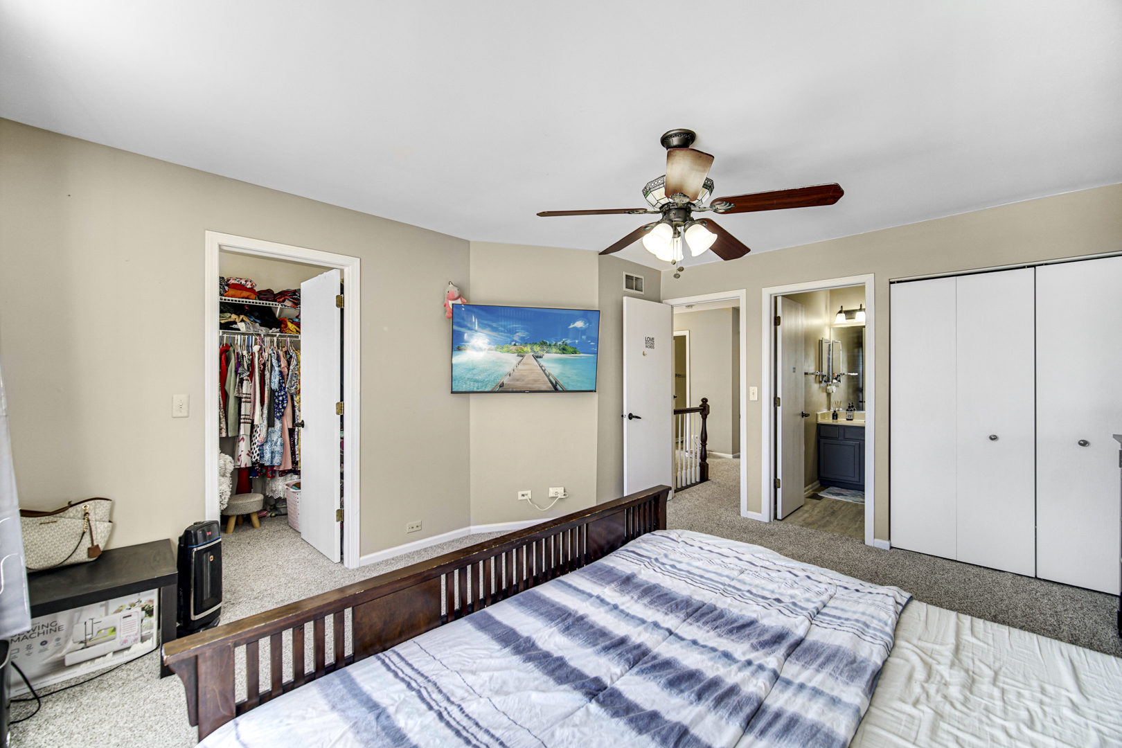 1384 Roxbury Drive Aurora, IL 60502 - Photo 10 of 24 a bedroom with bed and a chandelier