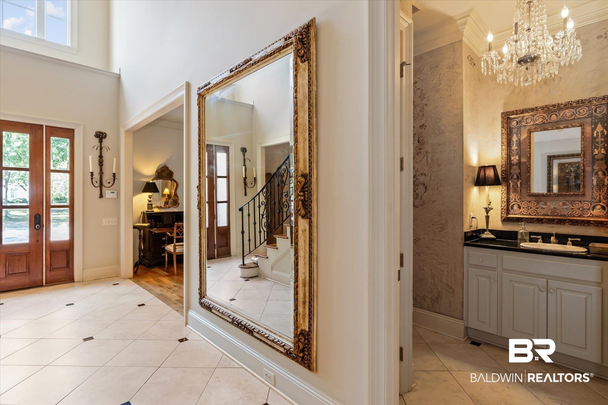 3963 Wimbledon Park Mobile, AL 36608 - Photo 31 of 51 Foyer featuring light hardwood / wood-style floors, a chandelier, ornamental molding, sink, and a towering ceiling
