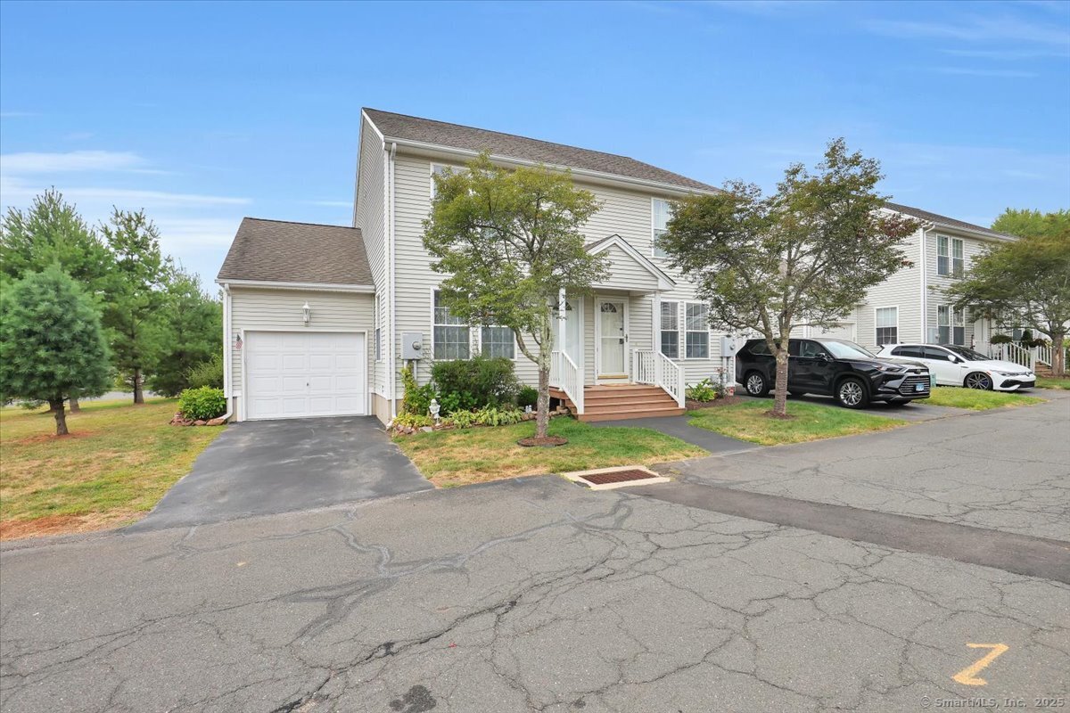 1 Sable Court, Unit 1 Farmington, CT 06085 - Photo 1 of 1 a house view with a garden space