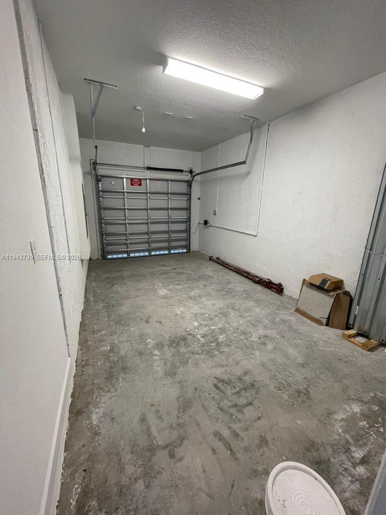 2634 Southeast 11th Court, Unit 2634 Homestead, FL 33035 - Photo 14 of 20 a view of a livingroom with storage