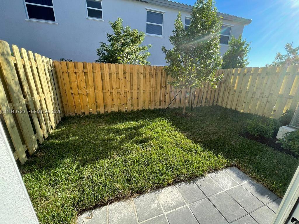 2634 Southeast 11th Court, Unit 2634 Homestead, FL 33035 - Photo 20 of 20 a view of a backyard with pathway