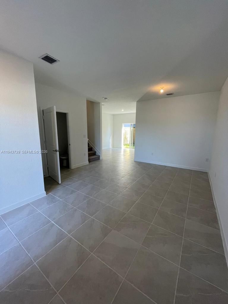 2634 Southeast 11th Court, Unit 2634 Homestead, FL 33035 - Photo 4 of 20 a view of a hallway with seating area