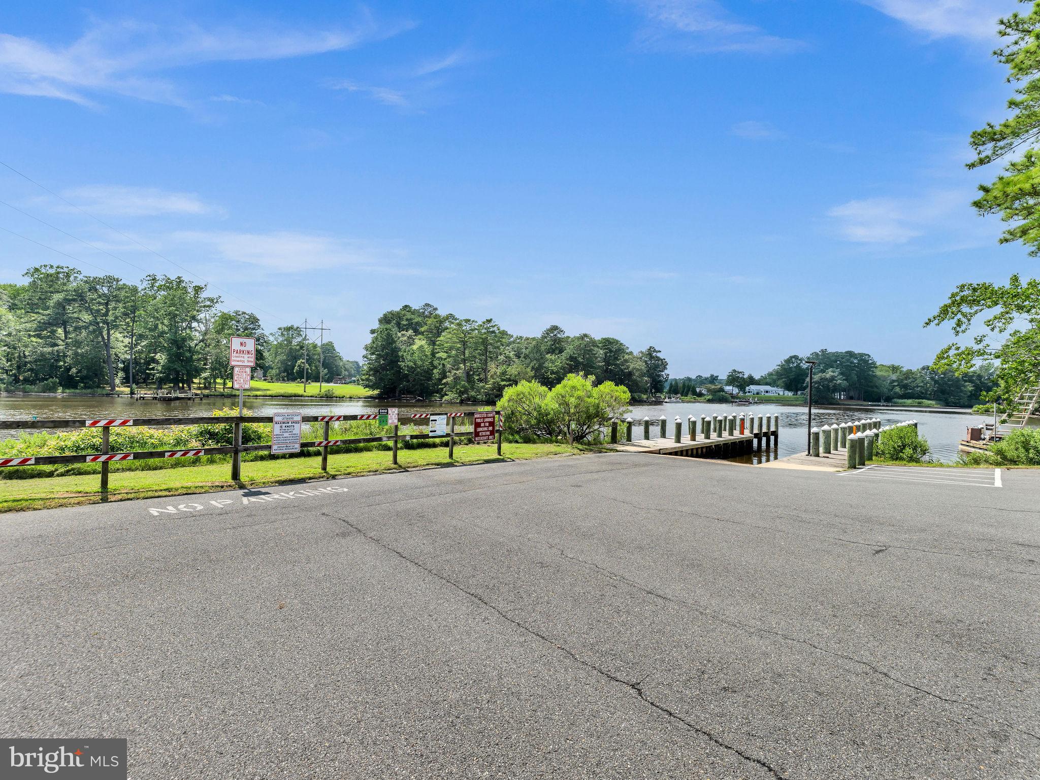 12623 Shell Mill Road, Unit 54 Bishopville, MD 21813 - Photo 21 of 24 a view of a road with a bench in front of it