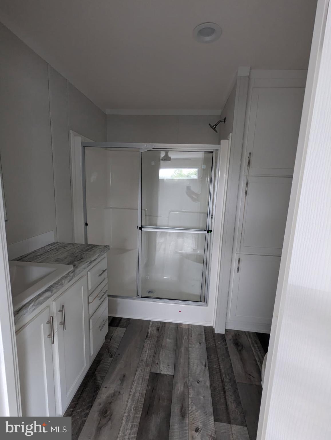12623 Shell Mill Road, Unit 54 Bishopville, MD 21813 - Photo 6 of 24 a bathroom with a sink and a mirror