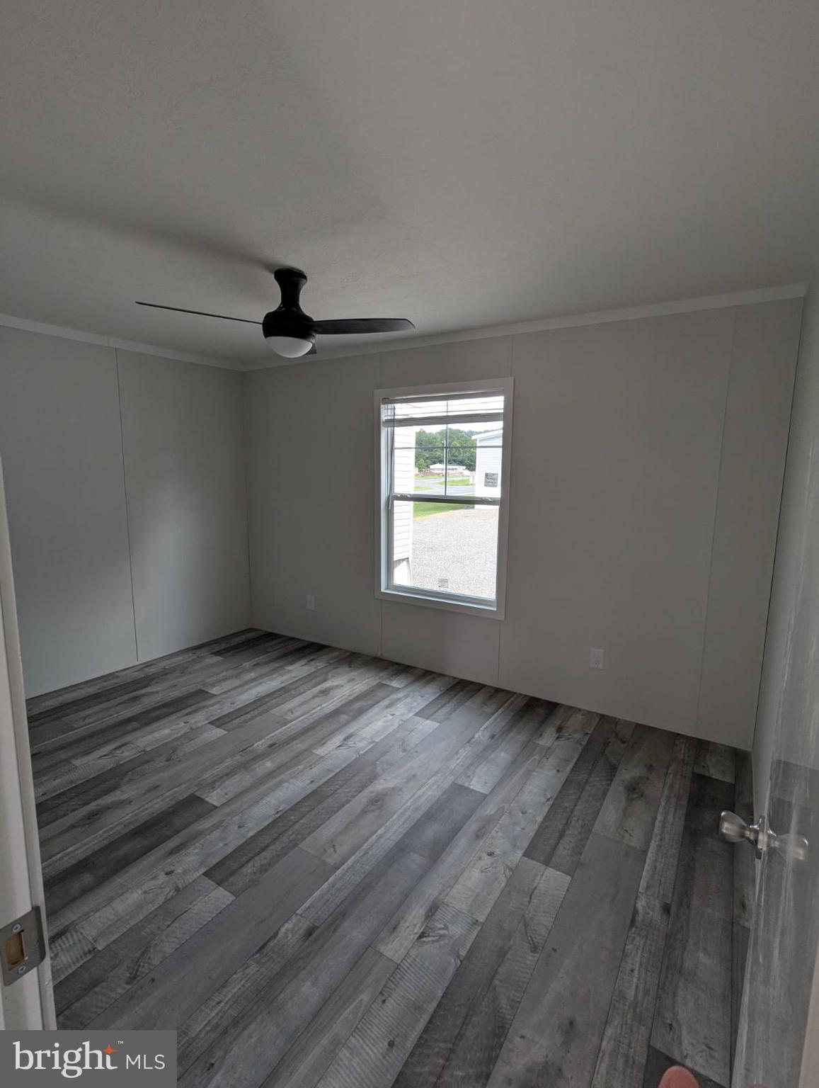 12623 Shell Mill Road, Unit 54 Bishopville, MD 21813 - Photo 9 of 24 a view of an empty room with a window