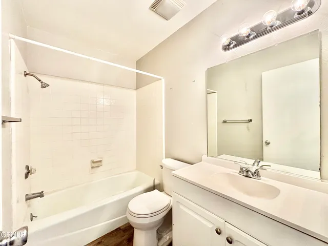 a bathroom with a sink a toilet and a bathtub