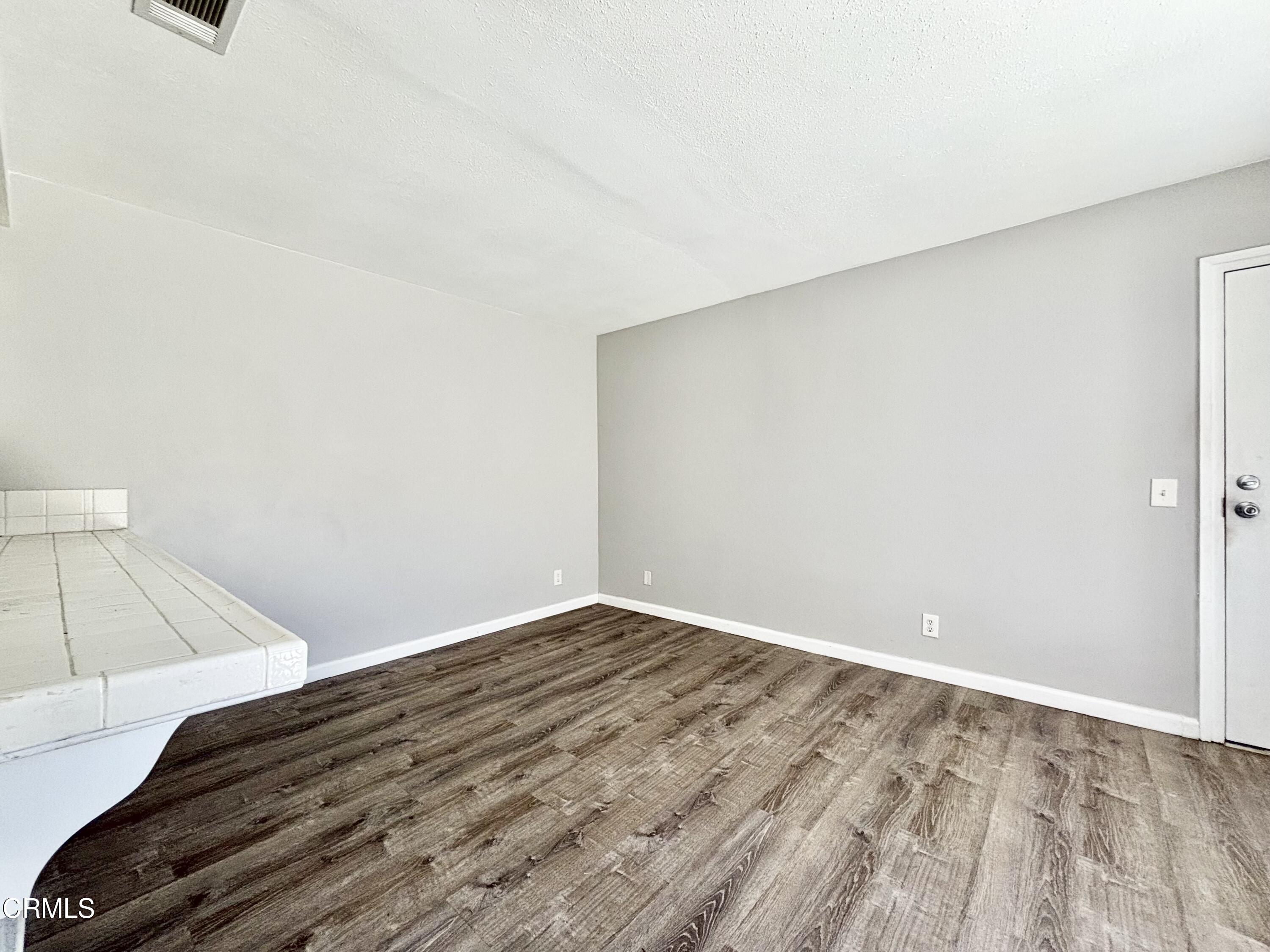 3604 Ketch Avenue Oxnard, CA 93035 - Photo 31 of 38 a view of a room with wooden floor