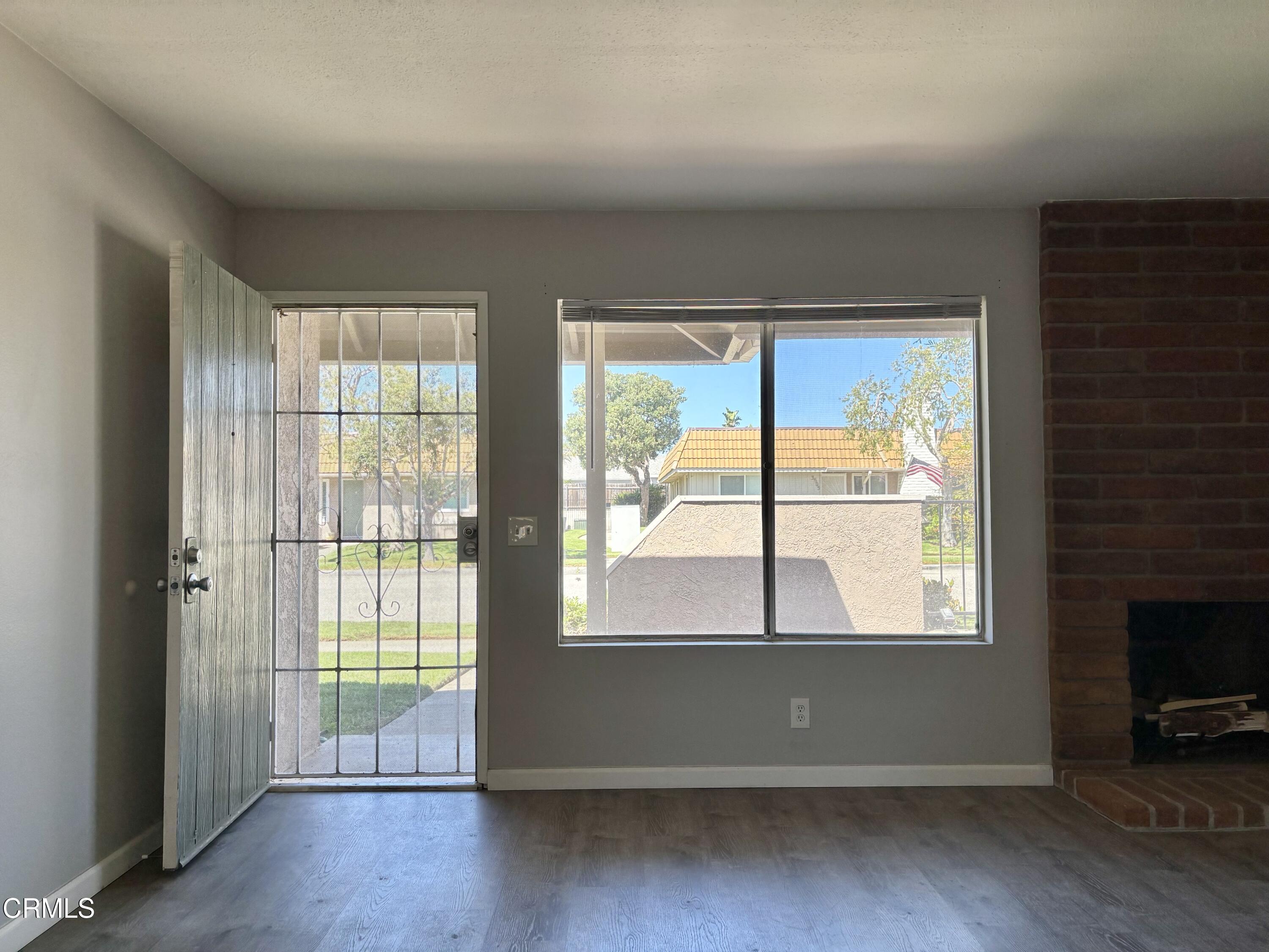 3604 Ketch Avenue Oxnard, CA 93035 - Photo 35 of 38 an empty room with wooden floor and windows