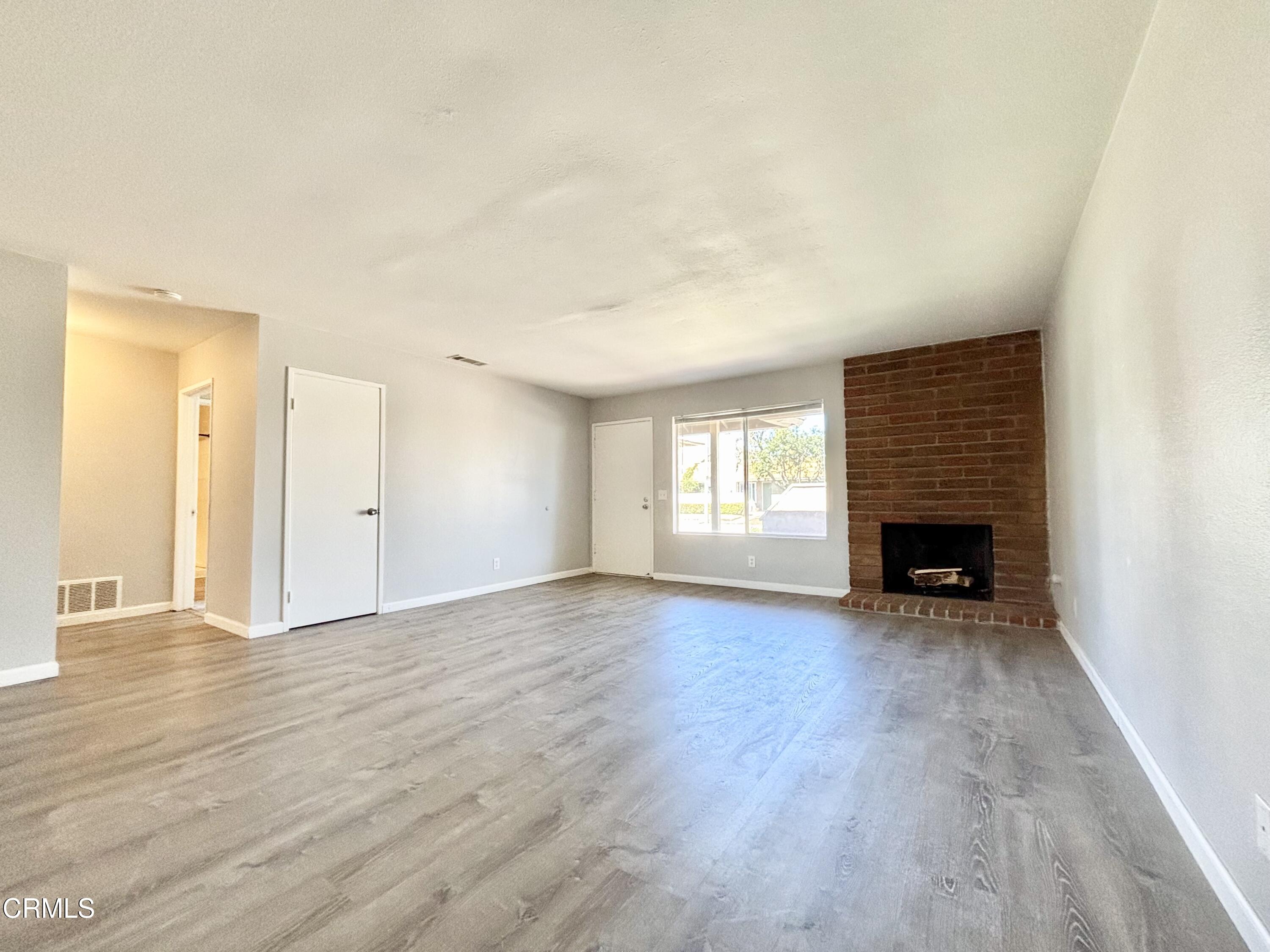 3604 Ketch Avenue Oxnard, CA 93035 - Photo 10 of 38 a view of an empty room with a window and fireplace