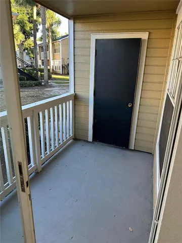 a view of a porch with a door