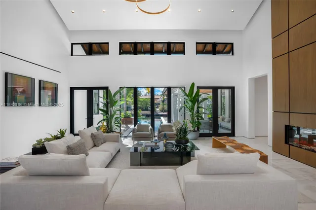 a bathroom with a granite countertop sink a mirror and shower