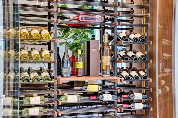 a living room with a couch and a potted plant