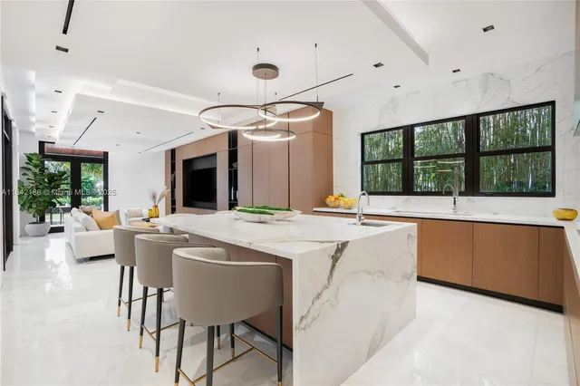 a bathroom with a sink a mirror and a shower