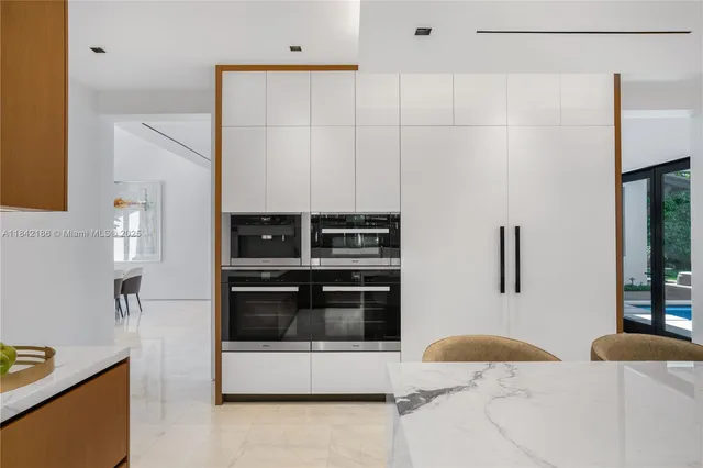 a bedroom with a large bed and a large window