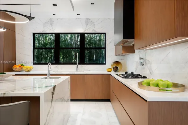a living room with furniture a flat screen tv and a large window