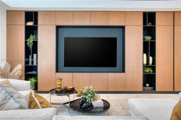 a living room with a washer and dryer