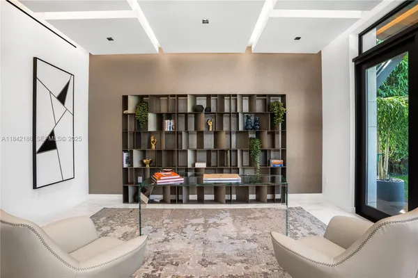 a view of a backyard with sitting area