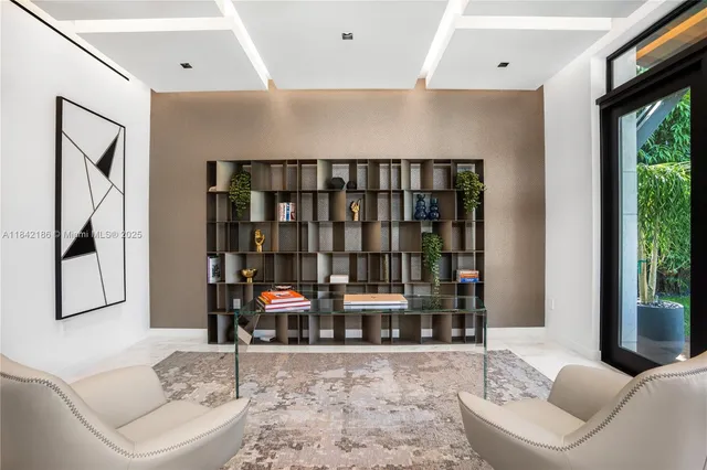 a living room with furniture and potted plant