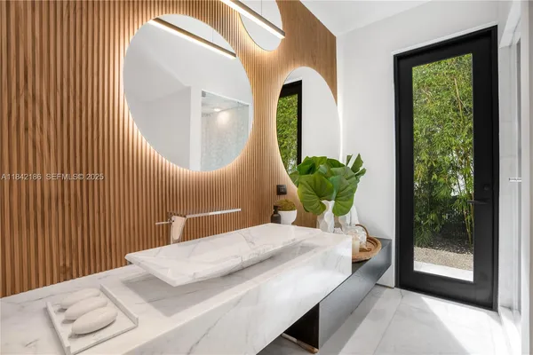 a view of a house with backyard sitting area and garden