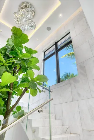 an aerial view of a house with a garden and lake view