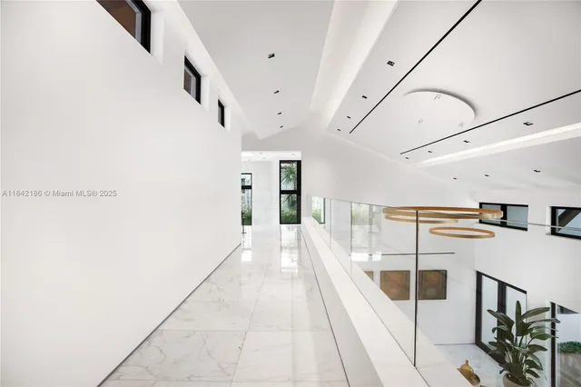 a front view of a house with a garden and porch