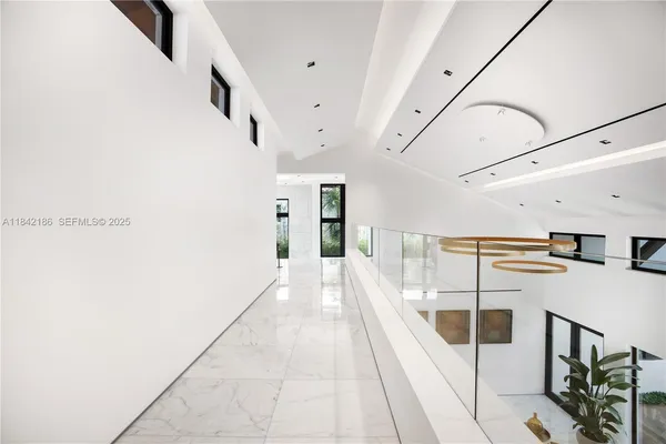 a view of a house with a swimming pool and furniture