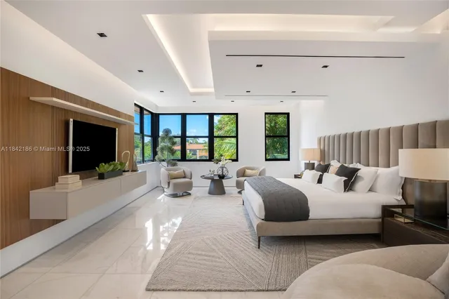 a view of a house with a swimming pool and furniture