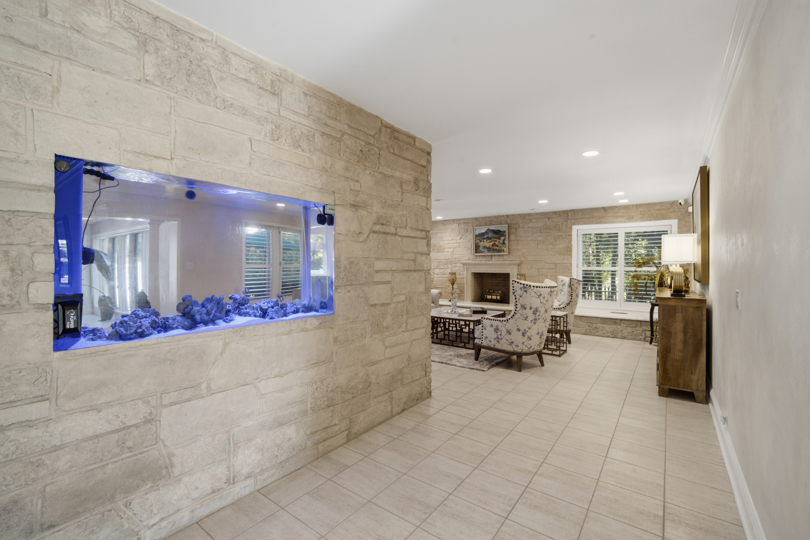 1601 Riverwoods Road Lincolnshire, IL 60045 - Photo 13 of 45 a living room with furniture and a chandelier