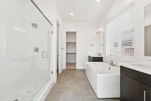 a bathroom with a bathtub and a sink