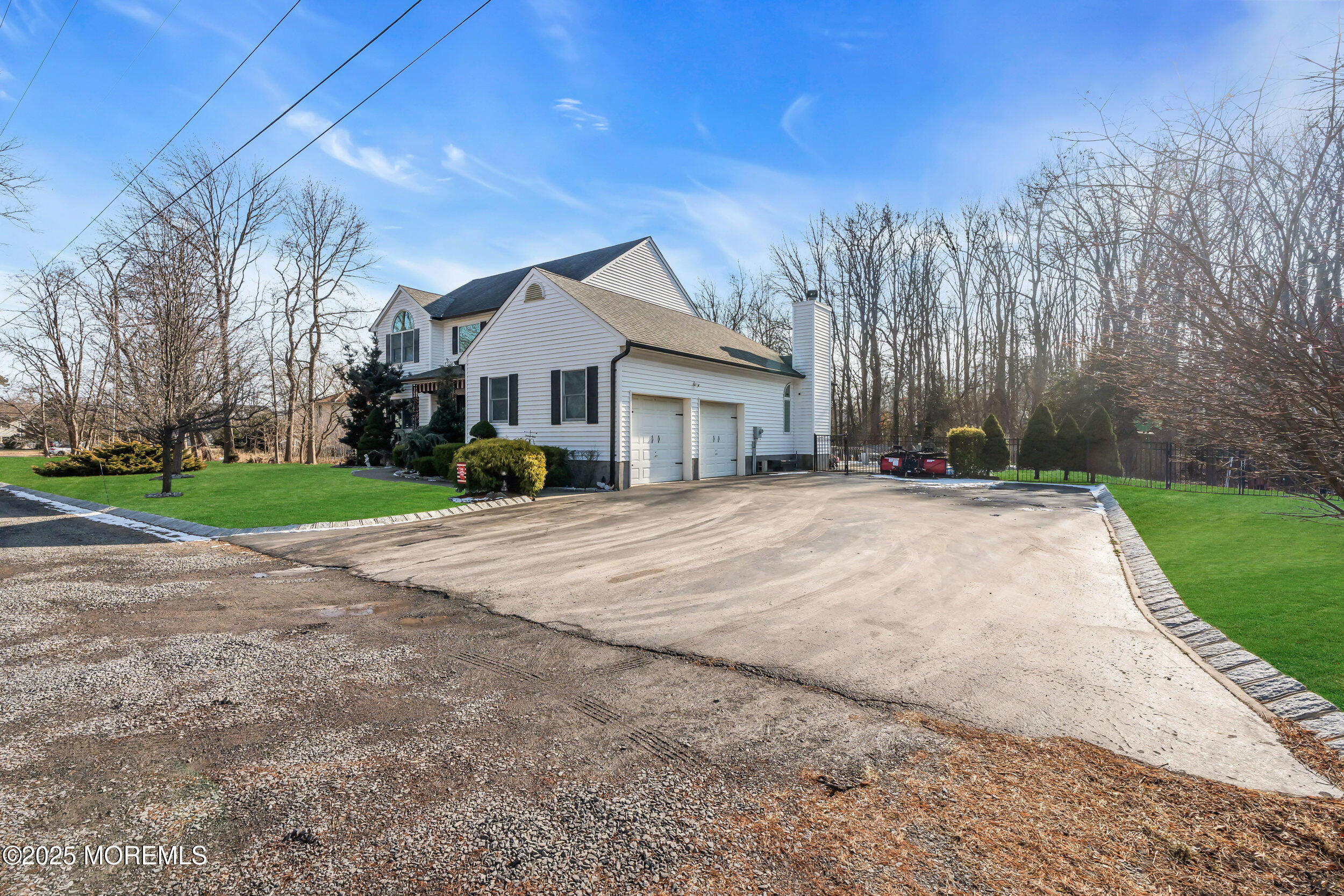 220 Whalepond Road Eatontown, NJ 07724 - Photo 15 of 54 a view of house with yard and trees in the background