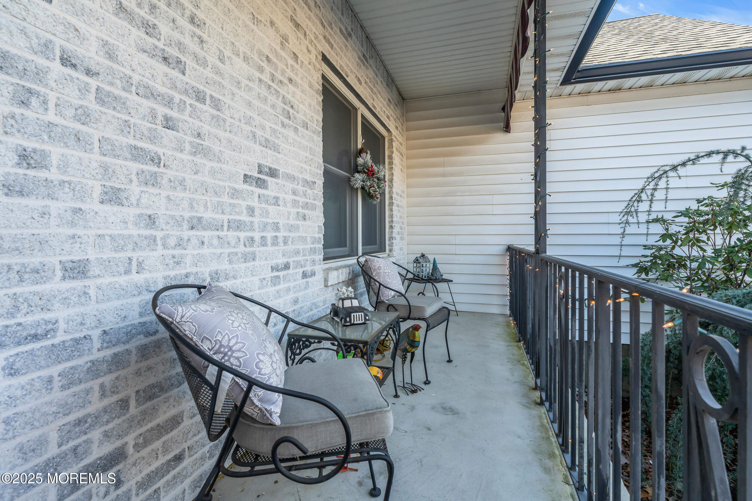 220 Whalepond Road Eatontown, NJ 07724 - Photo 16 of 54 a patio with table and chairs