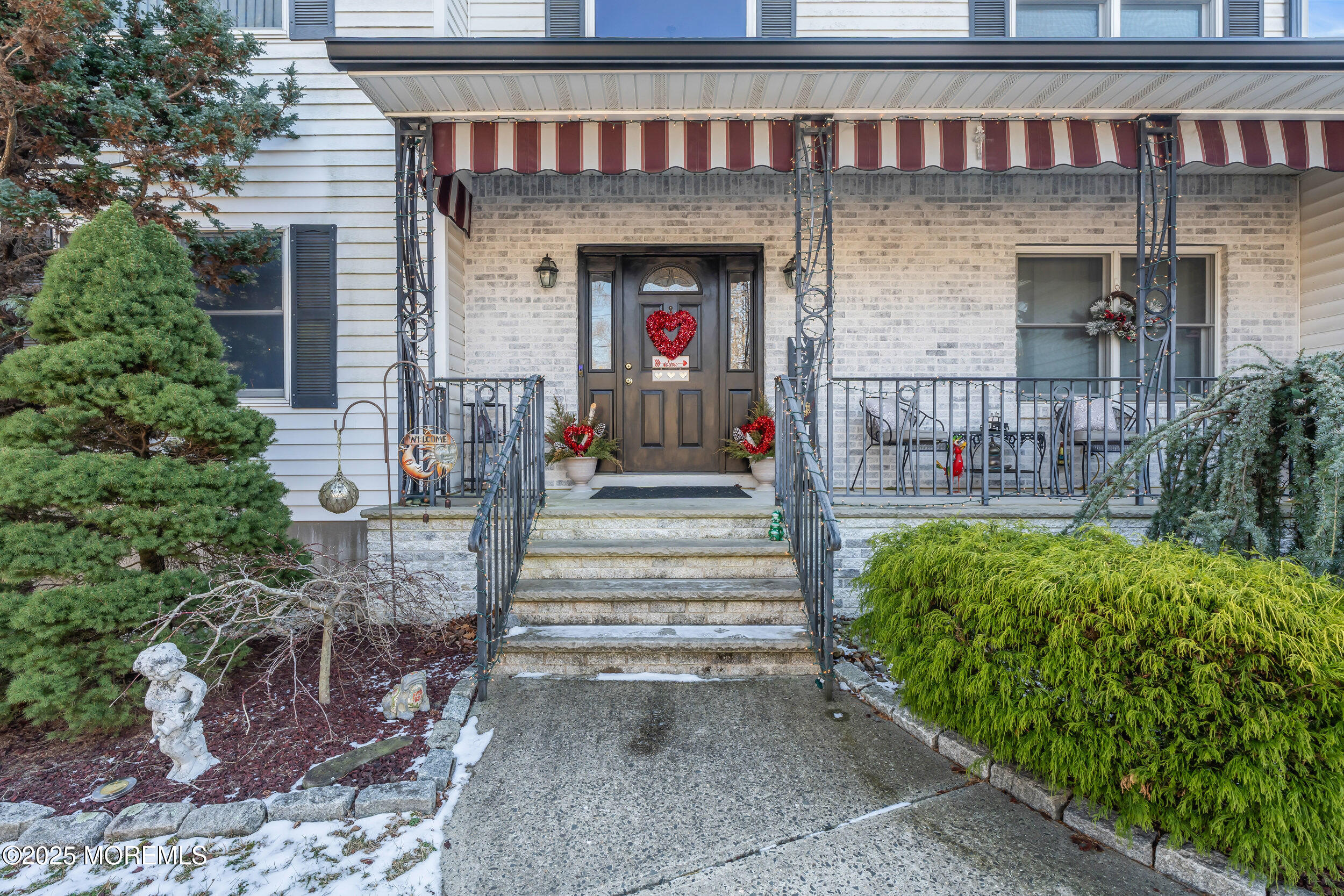 220 Whalepond Road Eatontown, NJ 07724 - Photo 17 of 54 a front view of a house with garden