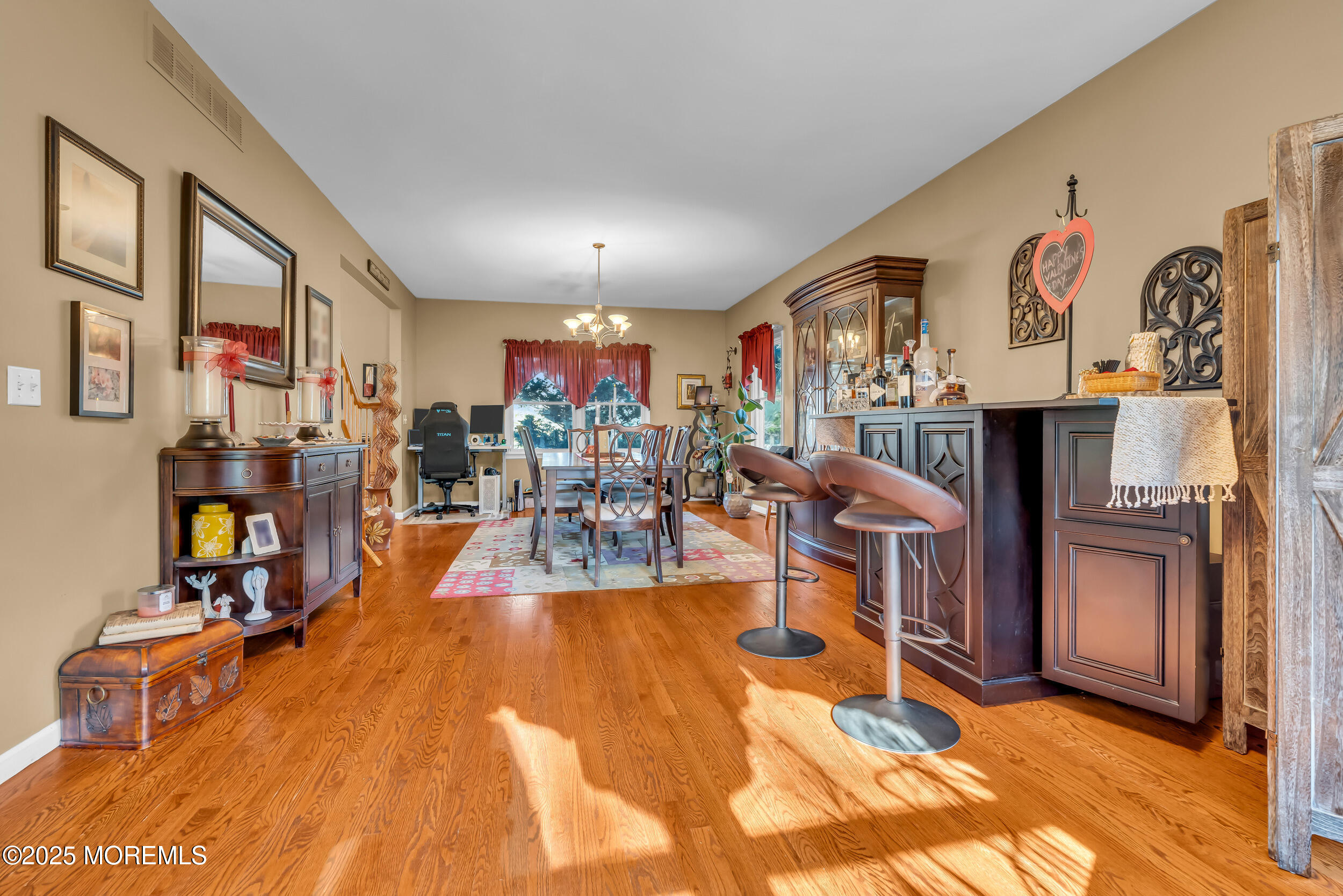 220 Whalepond Road Eatontown, NJ 07724 - Photo 25 of 54 a view of a livingroom with furniture and a flat screen tv