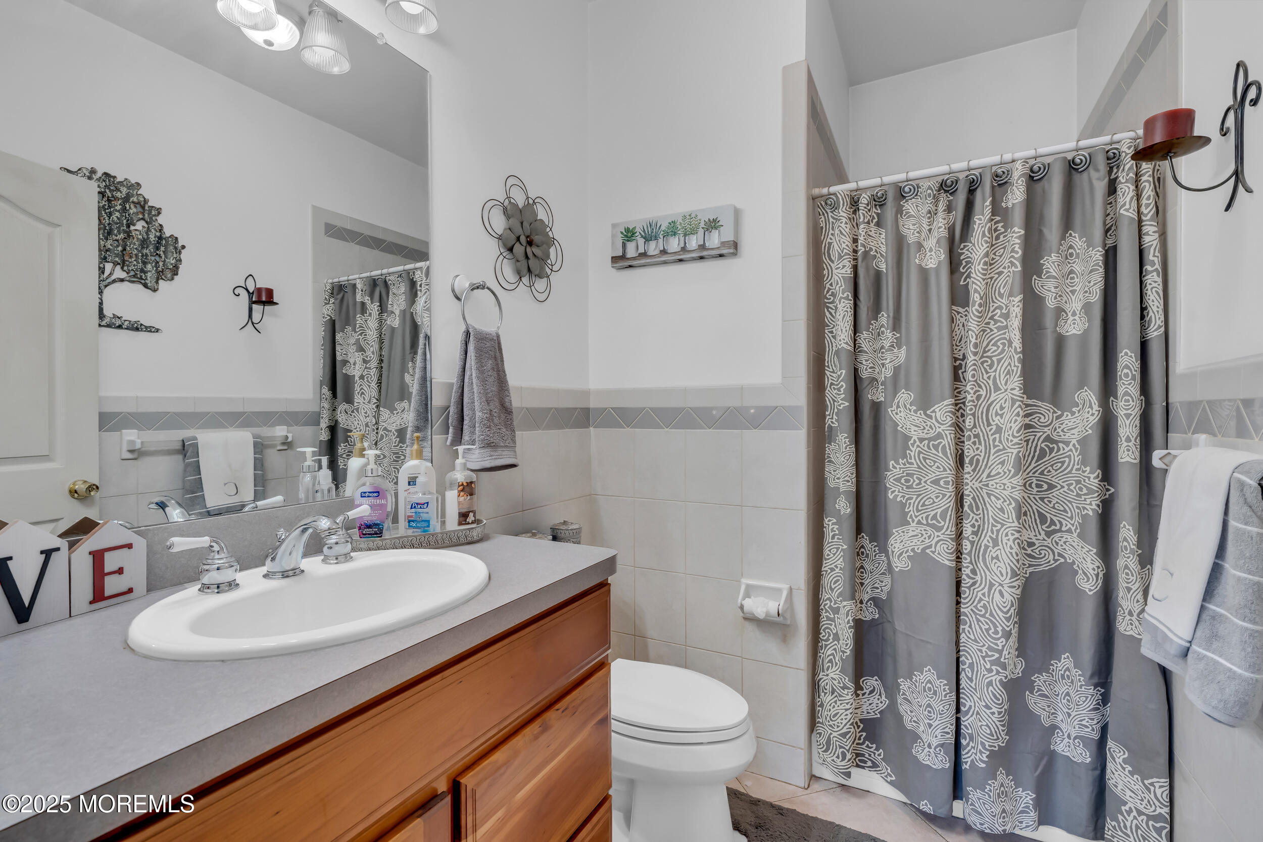 220 Whalepond Road Eatontown, NJ 07724 - Photo 34 of 54 a bathroom with a sink toilet and shower