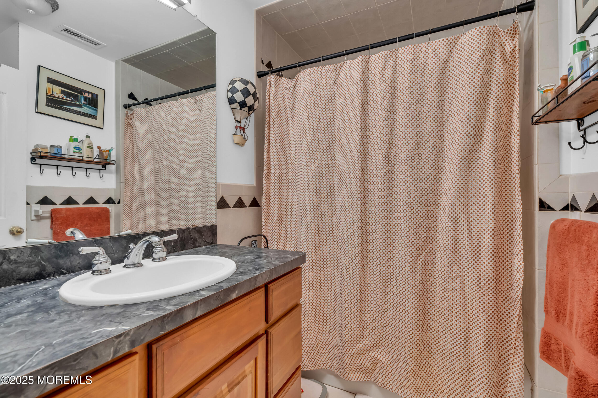 220 Whalepond Road Eatontown, NJ 07724 - Photo 45 of 54 a bathroom with a sink and a mirror