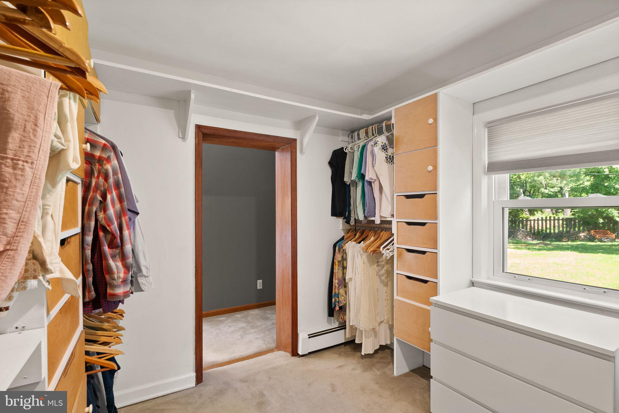815 Seneca Road Great Falls, VA 22066 - Photo 30 of 61 a view of walk in closet with clothes and shoes