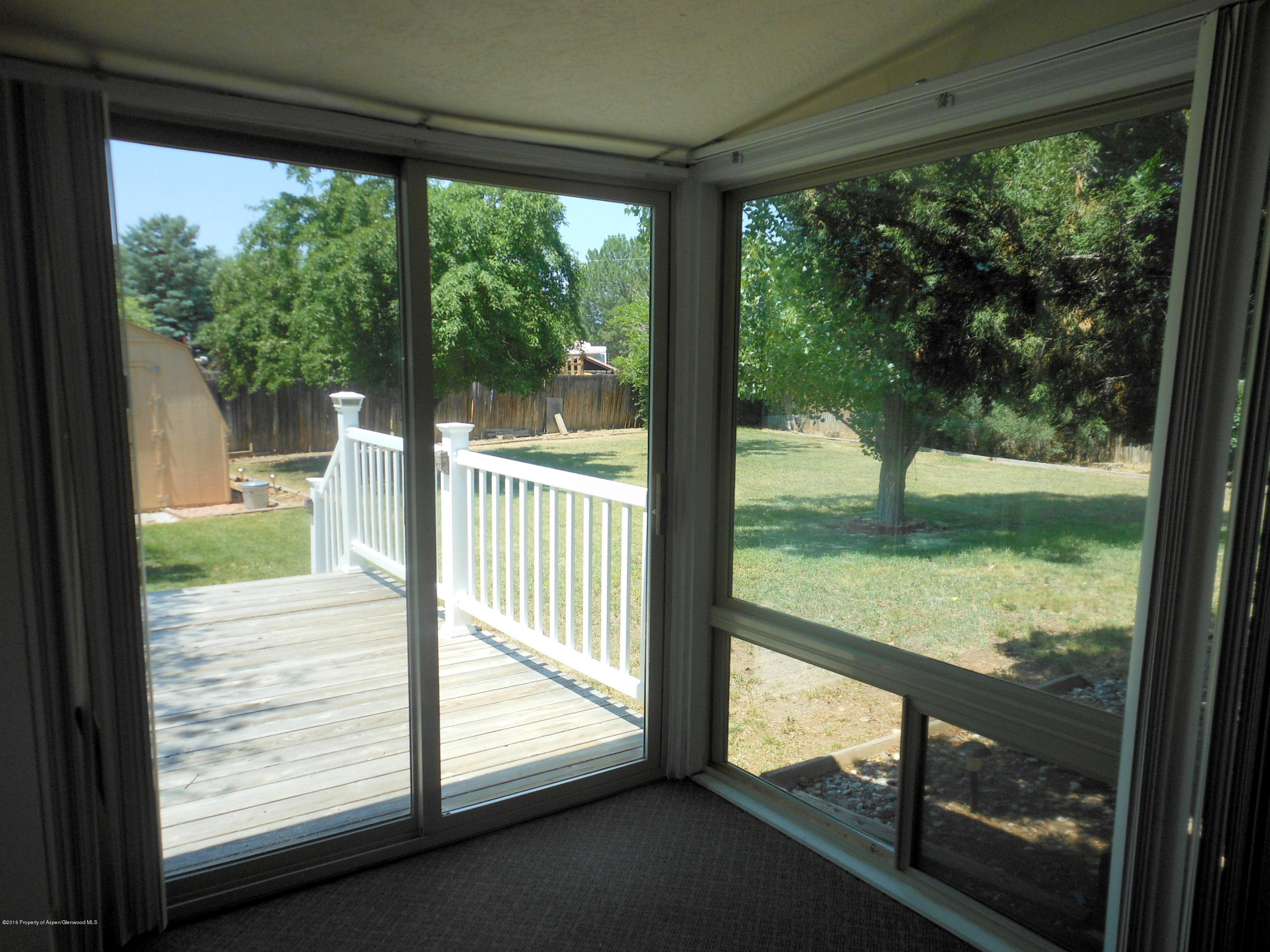 817 Cedar Drive Rifle, CO 81650 - Photo 20 of 24 a view of a glass door with a from a porch