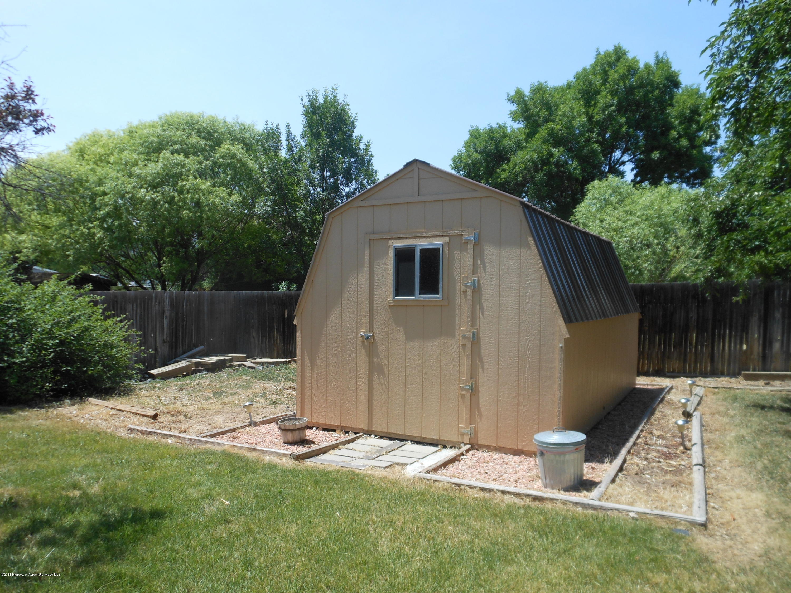817 Cedar Drive Rifle, CO 81650 - Photo 24 of 24 a backyard of a house with seating space