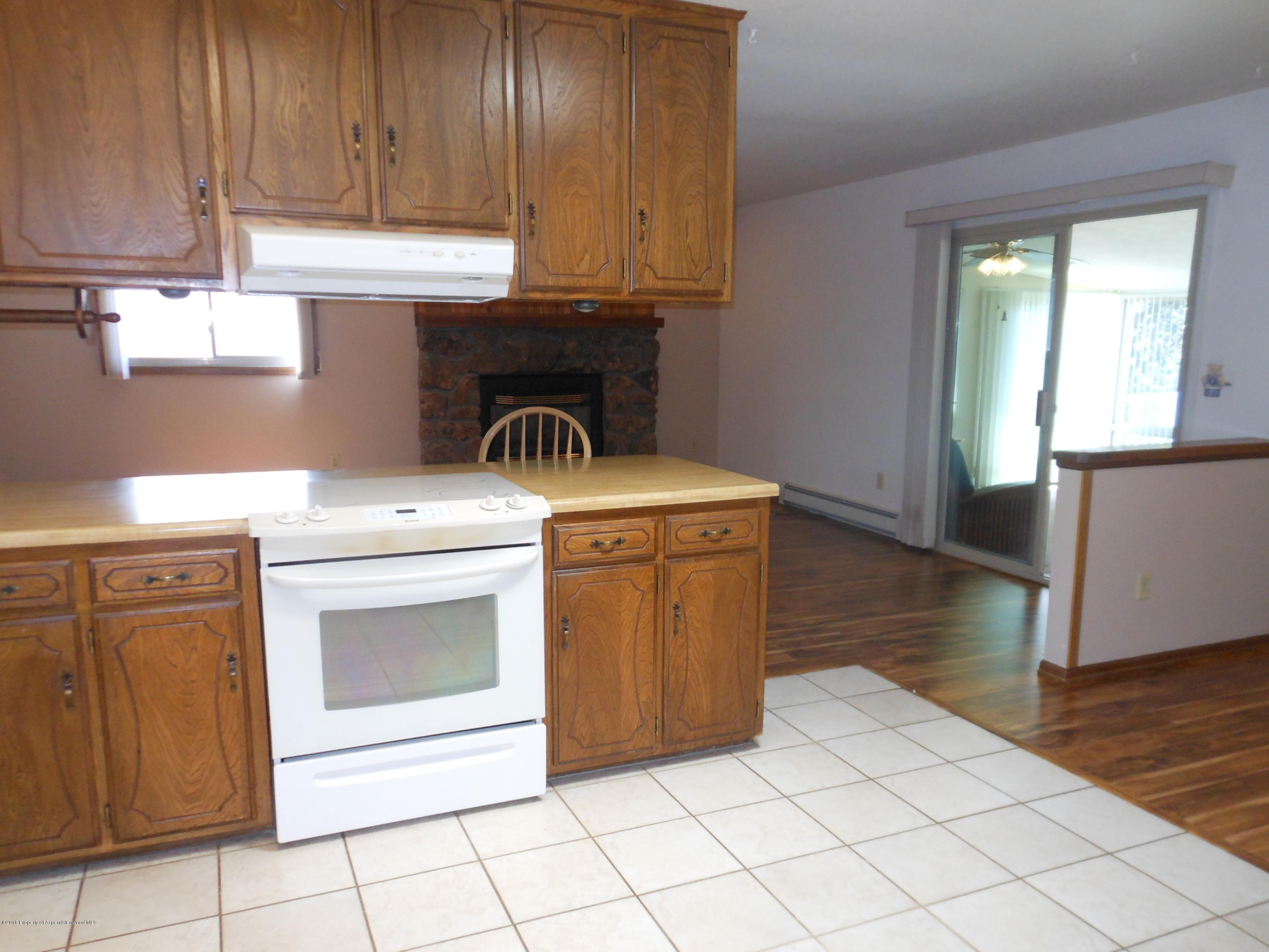 817 Cedar Drive Rifle, CO 81650 - Photo 3 of 24 a kitchen with a stove top oven sink and cabinets