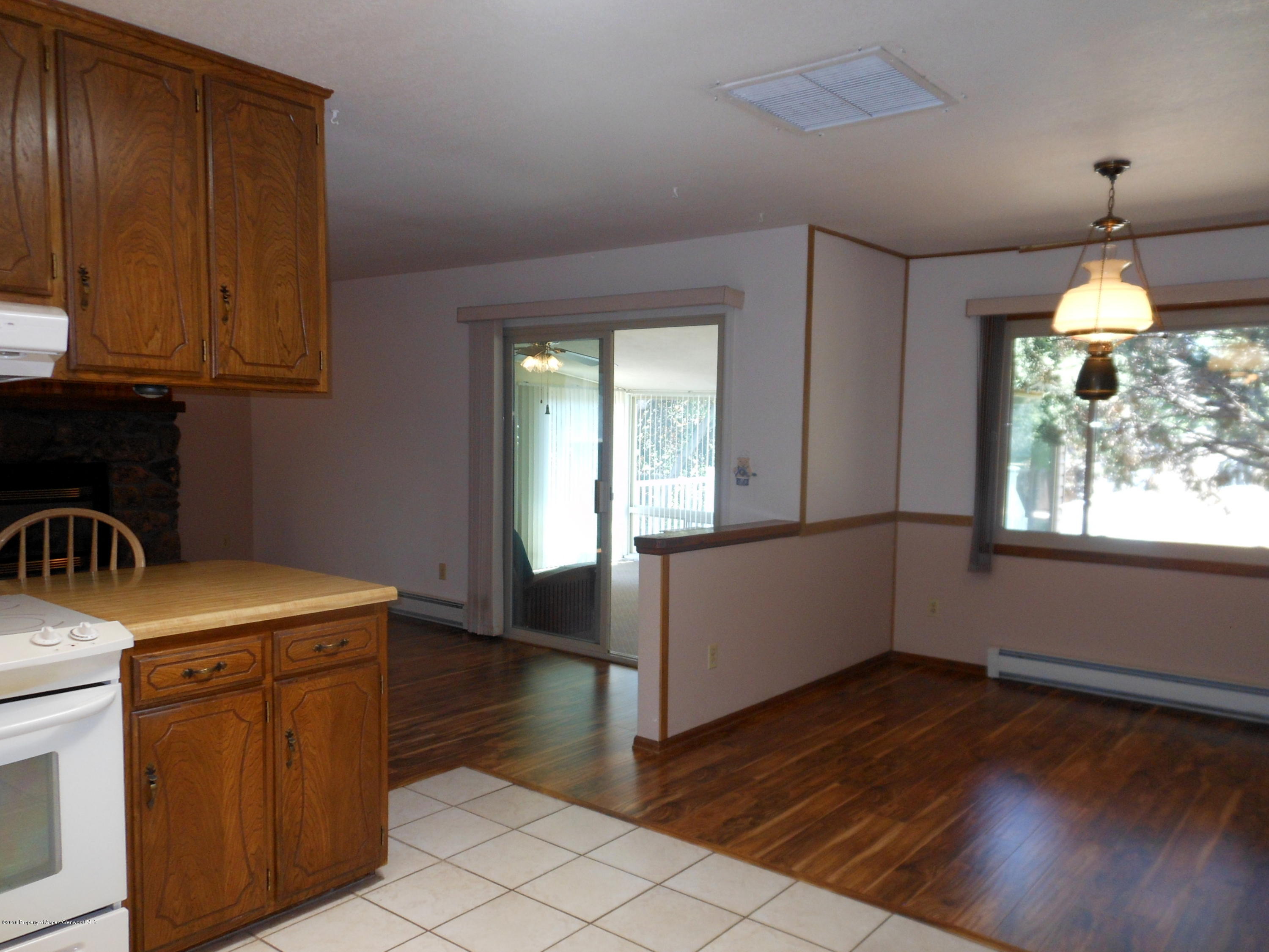 817 Cedar Drive Rifle, CO 81650 - Photo 4 of 24 a kitchen with a sink window and cabinets
