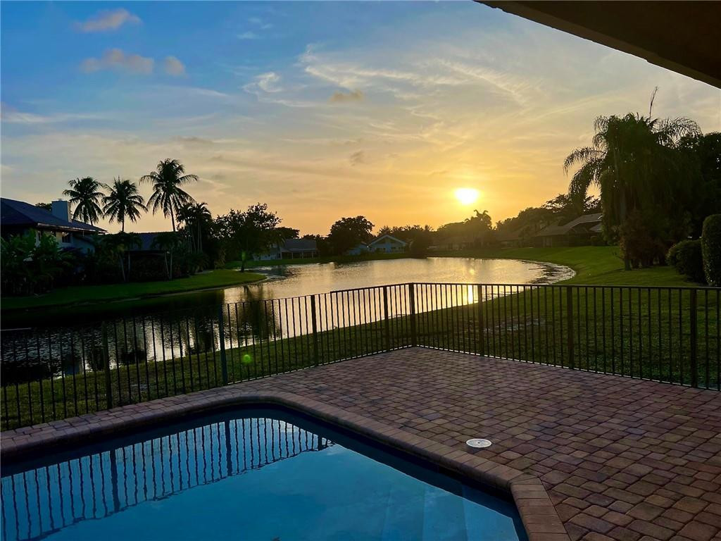 3110 Equestrian Drive Boca Raton, FL 33434 - Photo 2 of 48 Sunset from the Pool