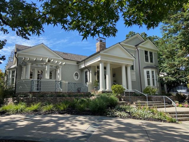 front view of a house with a garden