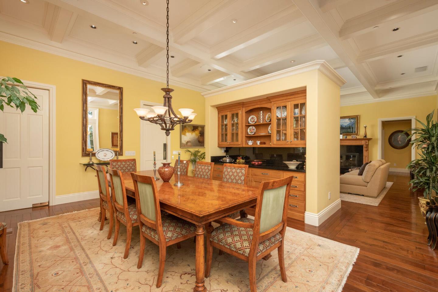 209 Bridge Road Hillsborough, CA 94010 - Photo 13 of 38 a dining room with furniture and wooden floor