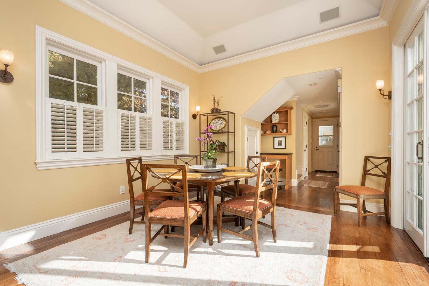209 Bridge Road Hillsborough, CA 94010 - Photo 16 of 38 a view of a dining room with furniture and wooden floor