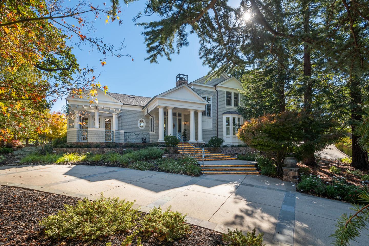 209 Bridge Road Hillsborough, CA 94010 - Photo 2 of 38 a front view of a house with a garden