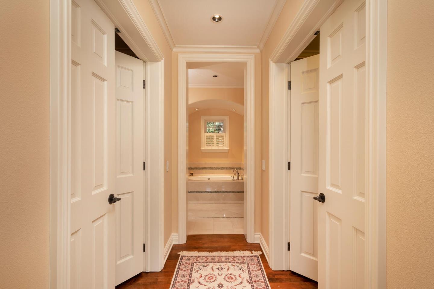 209 Bridge Road Hillsborough, CA 94010 - Photo 21 of 38 a view of a hallway with wooden floor and closet