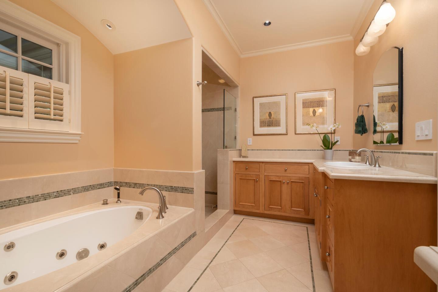 209 Bridge Road Hillsborough, CA 94010 - Photo 22 of 38 a bathroom with a tub sink and mirror