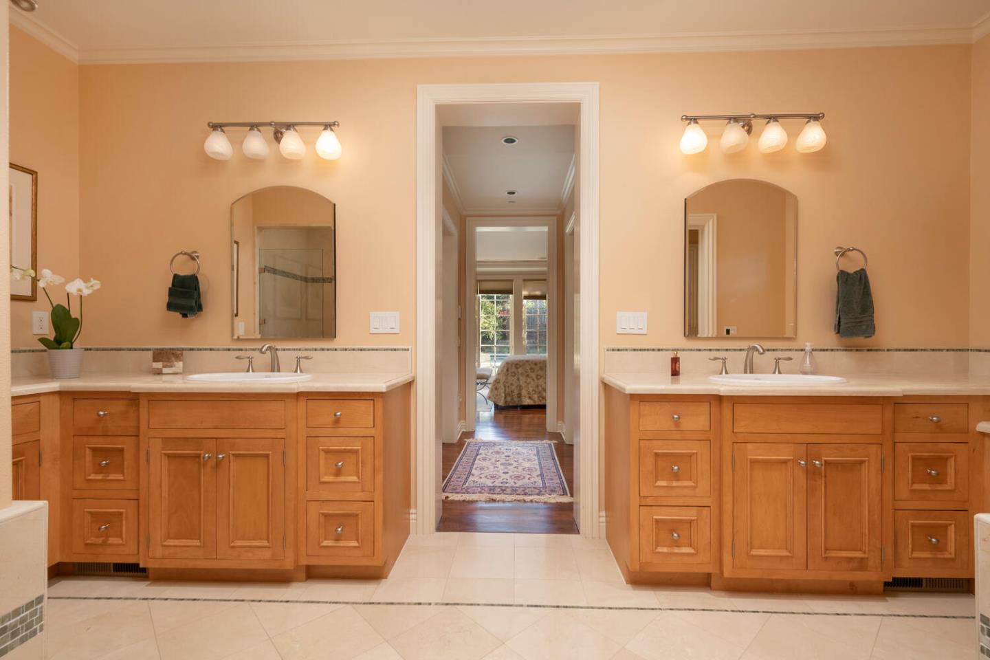 209 Bridge Road Hillsborough, CA 94010 - Photo 23 of 38 a bathroom with a double vanity sink and a mirror