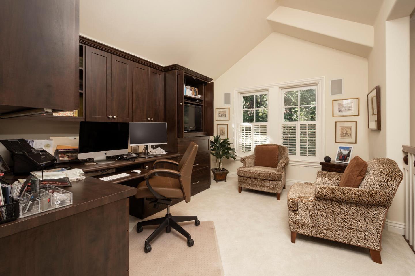 209 Bridge Road Hillsborough, CA 94010 - Photo 25 of 38 a living room with furniture and a flat screen tv
