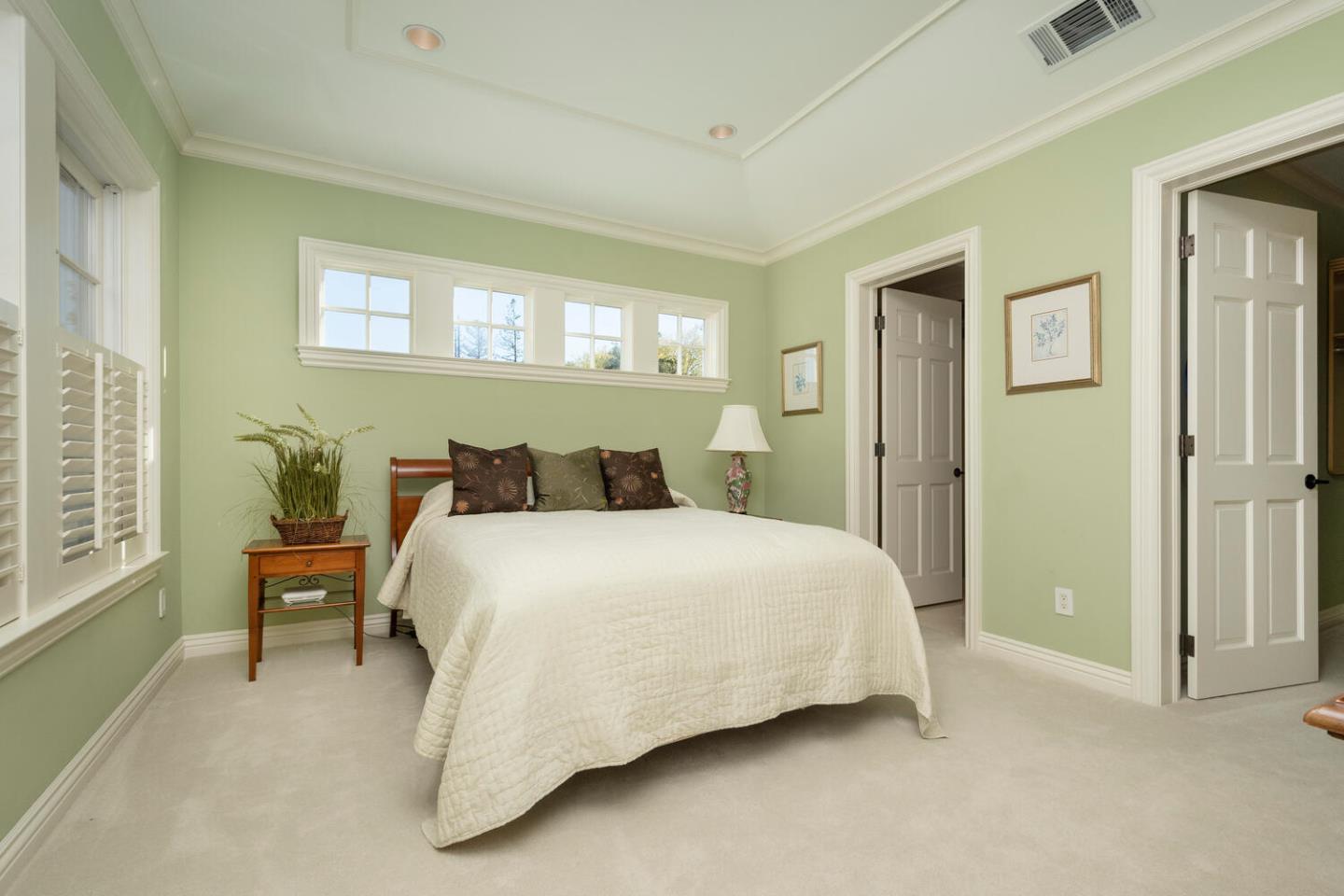 209 Bridge Road Hillsborough, CA 94010 - Photo 28 of 38 a bedroom with a bed and wooden floor